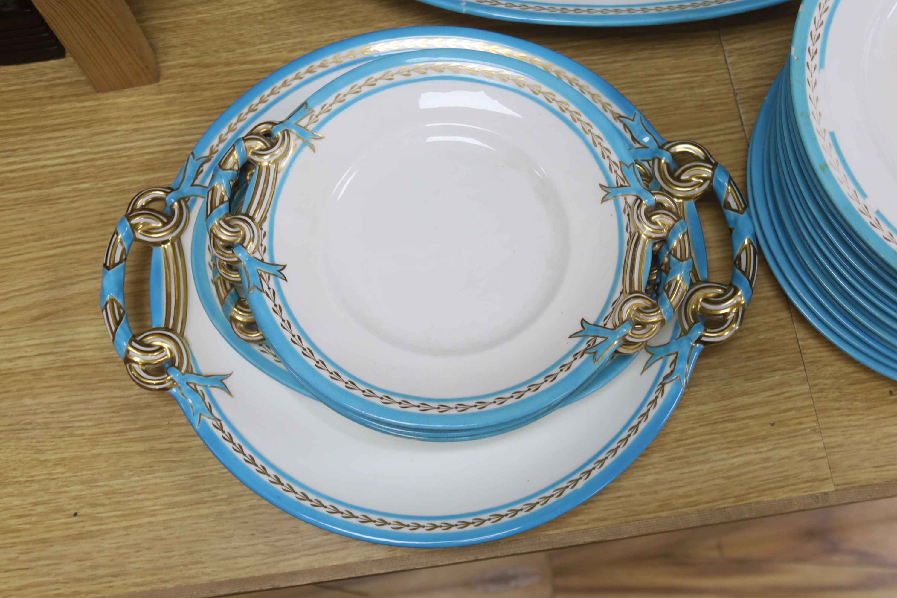 A Victorian Mintons part service with blue and gilt border